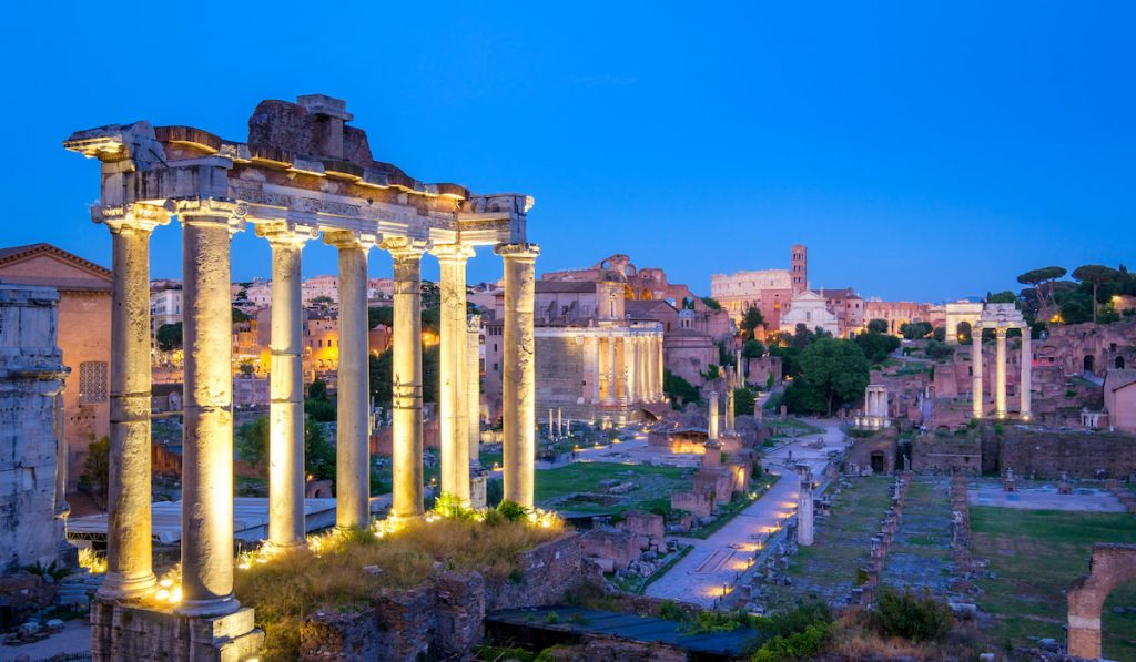 Forum Romanum archeological site in Rome after sunset 