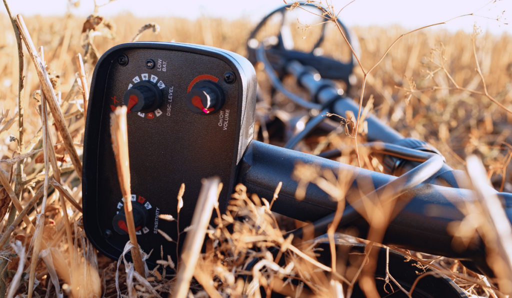 Metal detector device lying on the ground