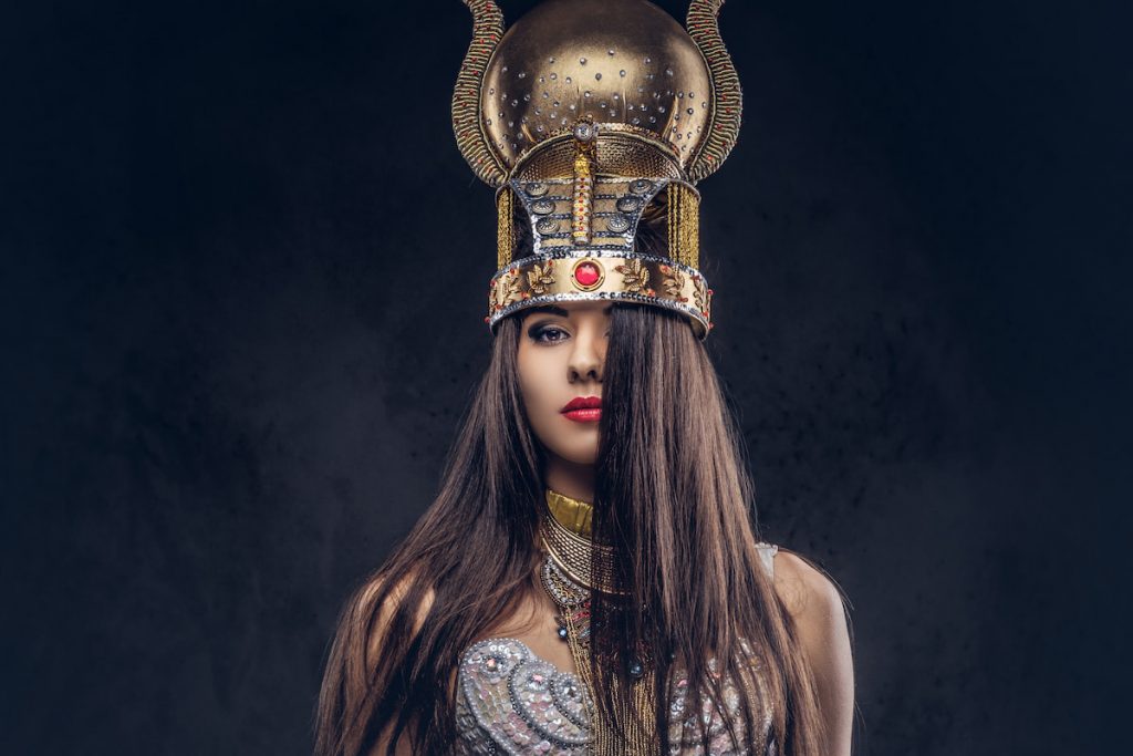 Portrait of haughty Egyptian queen in an ancient pharaoh costume